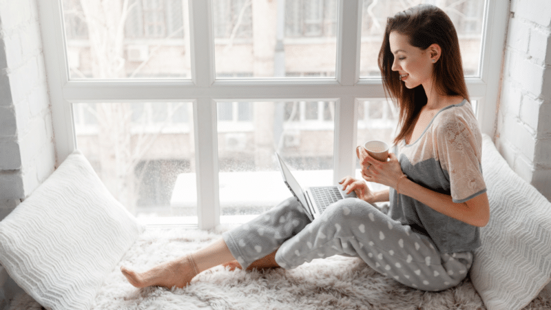 woman laptop bed